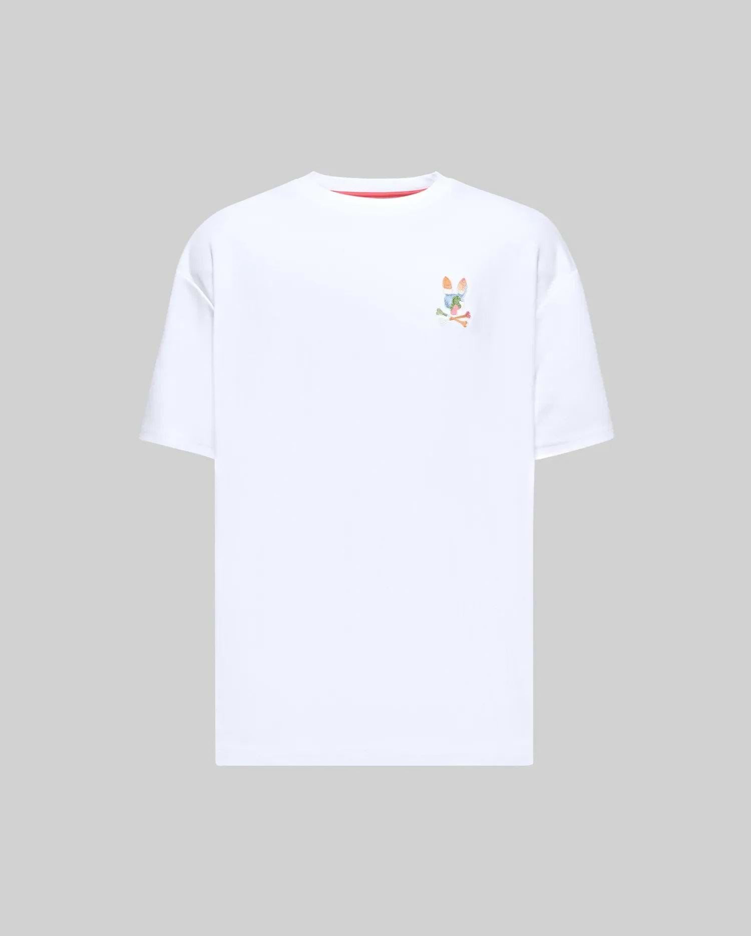 Mens Ara Oversized Tee, a white oversized jersey t-shirt featuring a small, multicolor embroidered Psycho Bunny skull logo on the left chest and subtle red collar trim. (4)