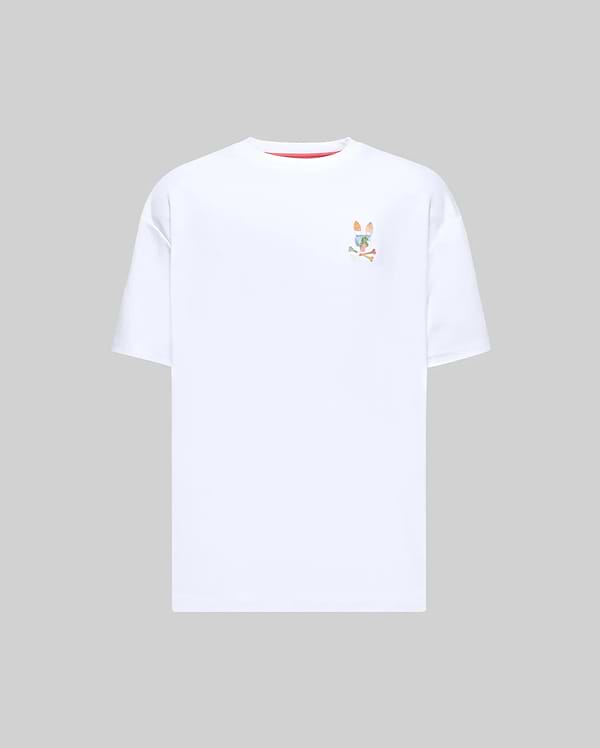 Mens Ara Oversized Tee, a white oversized jersey t-shirt featuring a small, multicolor embroidered Psycho Bunny skull logo on the left chest and subtle red collar trim. (4)