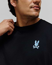 Black Mens Aiden Back Graphic Tee, a classic fit jersey knit t-shirt with a small, light blue embroidered Psycho Bunny skull logo on the left chest. (3)