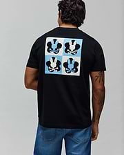 Mens Aiden Back Graphic Tee, black classic fit jersey t-shirt with a large back graphic featuring a checkerboard of light blue and white squares, each containing a black or white Psycho Bunny skull logo. (1)