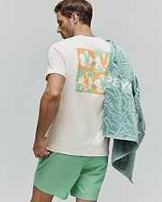 Mens Aiden Back Graphic Tee, an off-white classic fit jersey t-shirt featuring a large back graphic with a checkerboard pattern of orange and light green Psycho Bunny skull logos. (1)