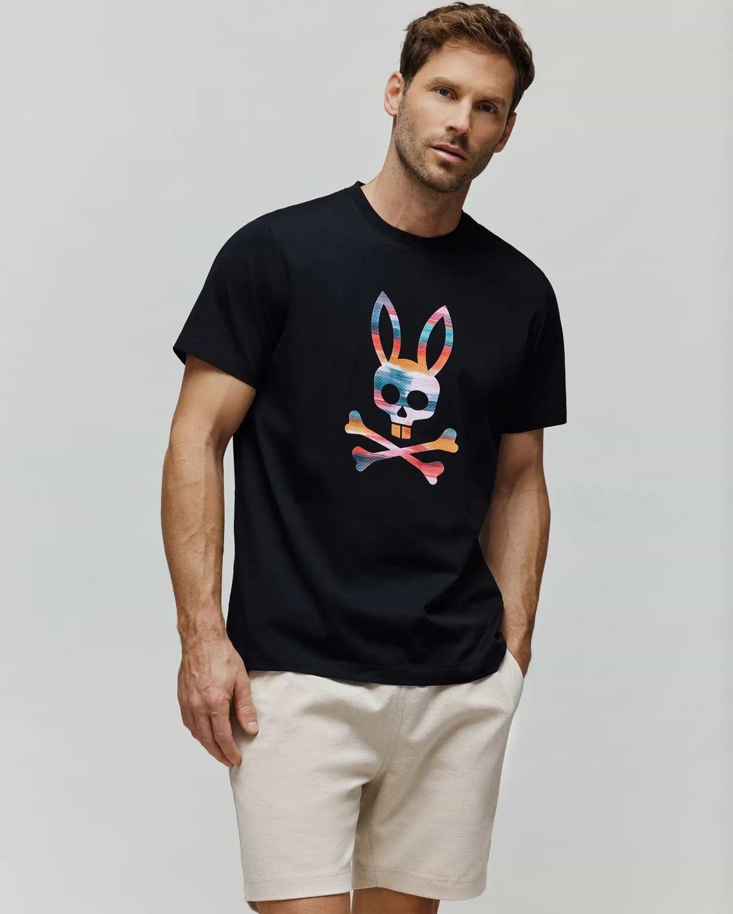 Mens Raphael Graphic Tee, black classic fit jersey t-shirt featuring a large, vibrant multi-color striped Psycho Bunny skull and crossbones graphic on the center chest. (4)