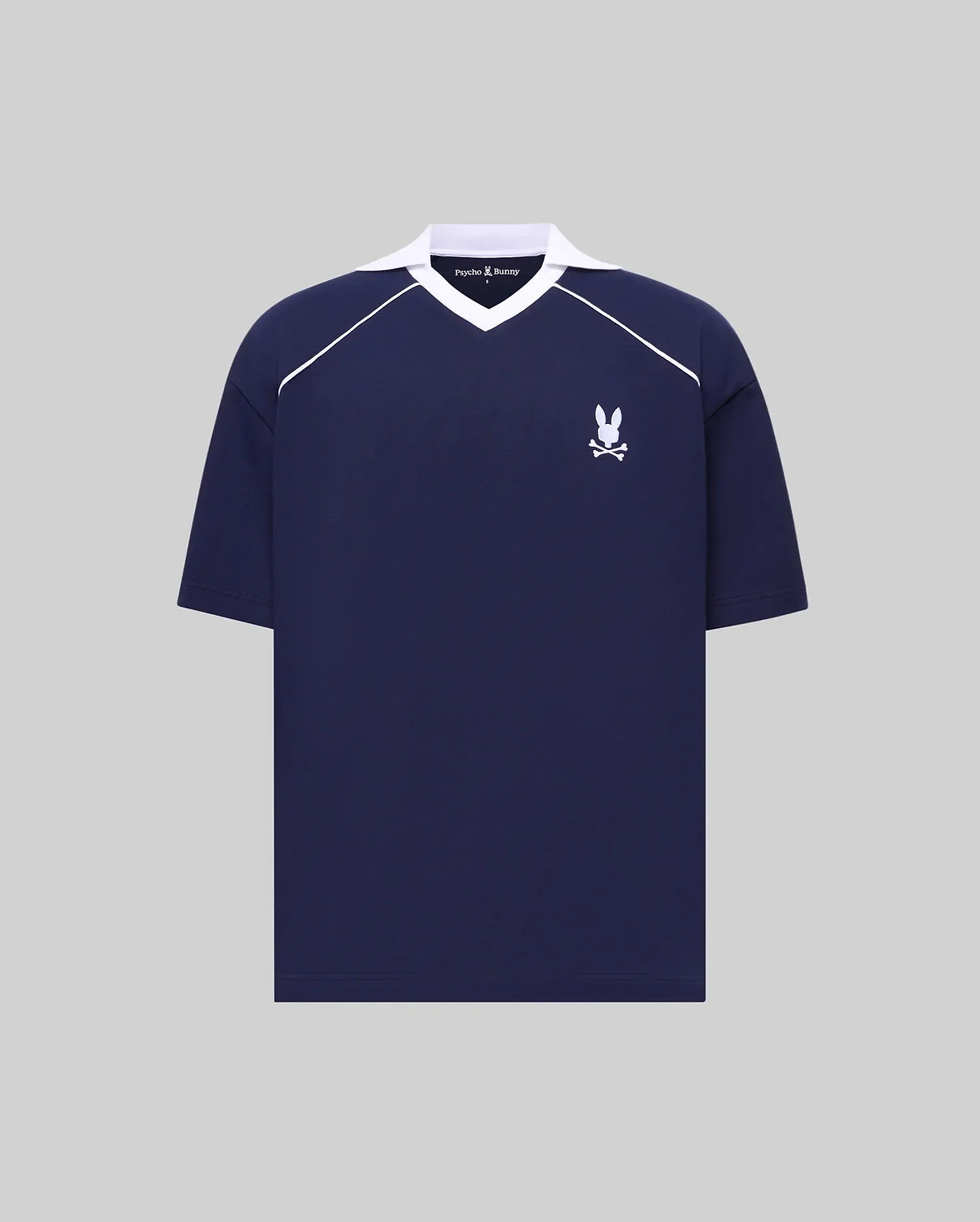 Mens Toby Jersey navy collared V-neck shirt with white raglan stripes, embroidered white Psycho Bunny skull logo on left chest. Relaxed fit jersey, small brand text on collar. (5)