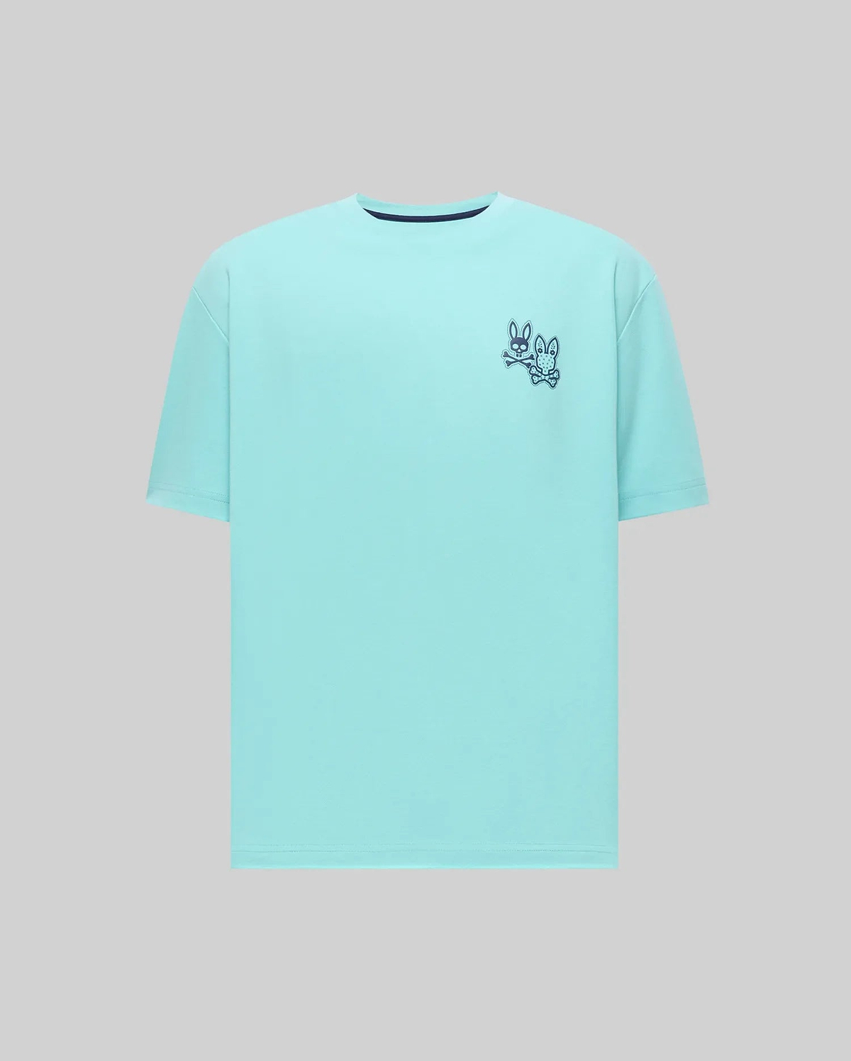 Mens Luke Back Graphic Tee: Relaxed fit aqua jersey t-shirt with a small dark blue double Psycho Bunny skull and crossbones graphic on the front left chest and a navy neck trim. (5)