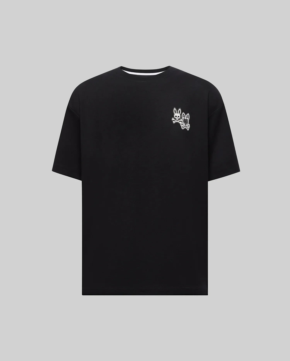 Mens Luke Back Graphic Tee, a black relaxed fit jersey knit t-shirt featuring a small white iconic Psycho Bunny skull and patterned bunny graphic on the left chest.
