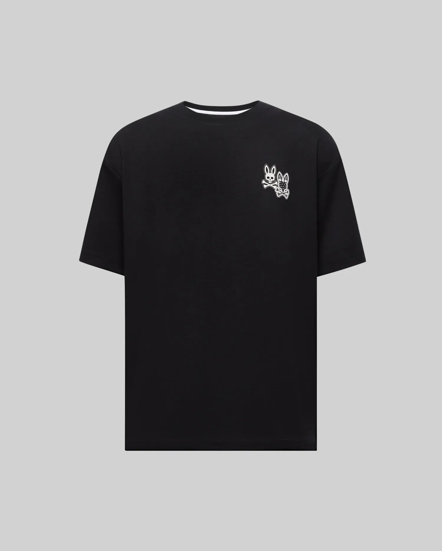 Mens Luke Back Graphic Tee, a black relaxed fit jersey knit t-shirt featuring a small white iconic Psycho Bunny skull and patterned bunny graphic on the left chest.