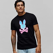 Mens Caspian Graphic Tee, a black classic fit jersey t-shirt featuring a prominent center chest graphic print of the iconic Psycho Bunny skull logo with a vibrant blue and pink gradient fill.