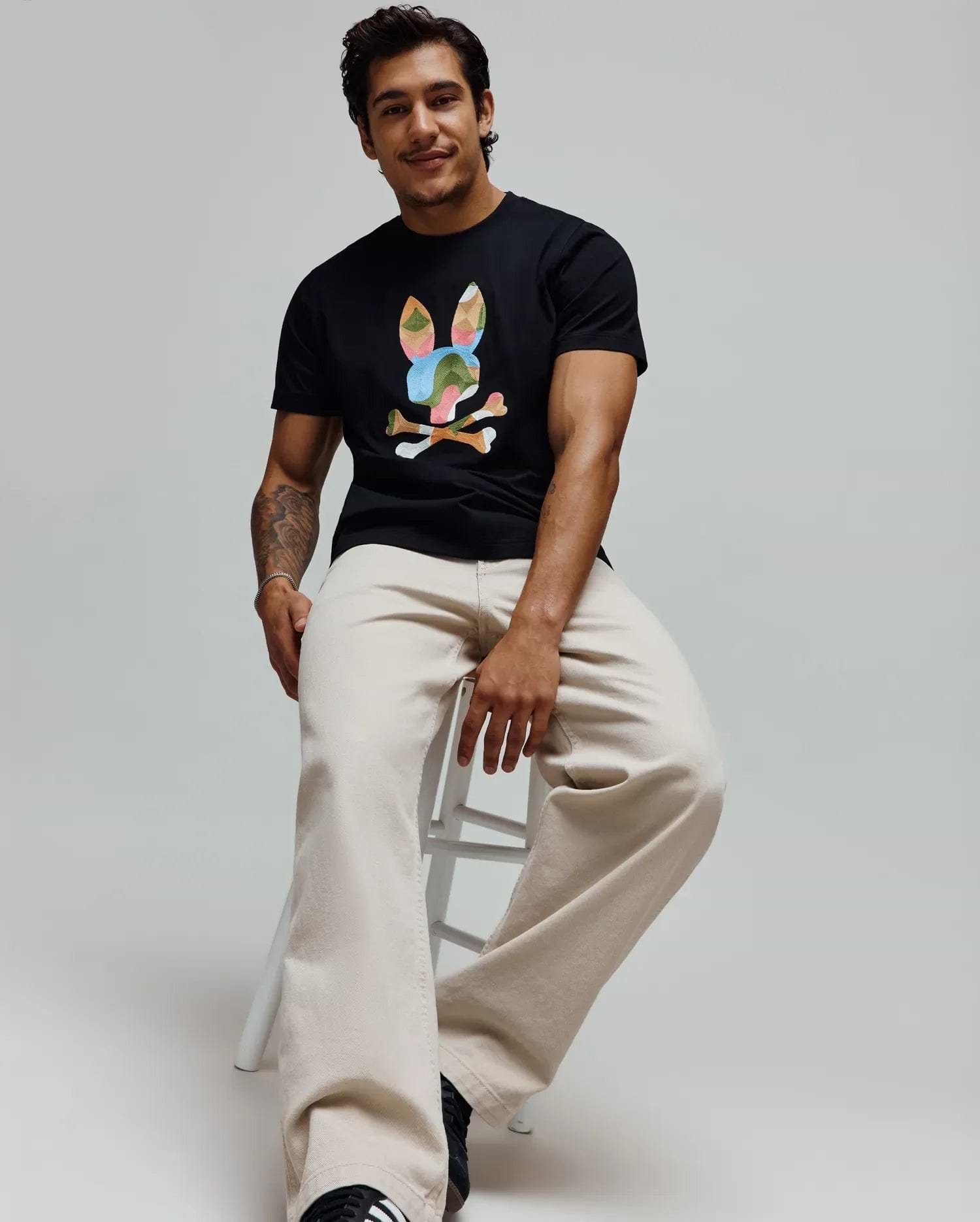 Mens Ara Graphic Tee in black, a classic fit soft jersey t-shirt featuring a large, multicolor graphic bunny skull logo prominently displayed on the center chest, showcasing iconic Psycho Bunny branding. (4)