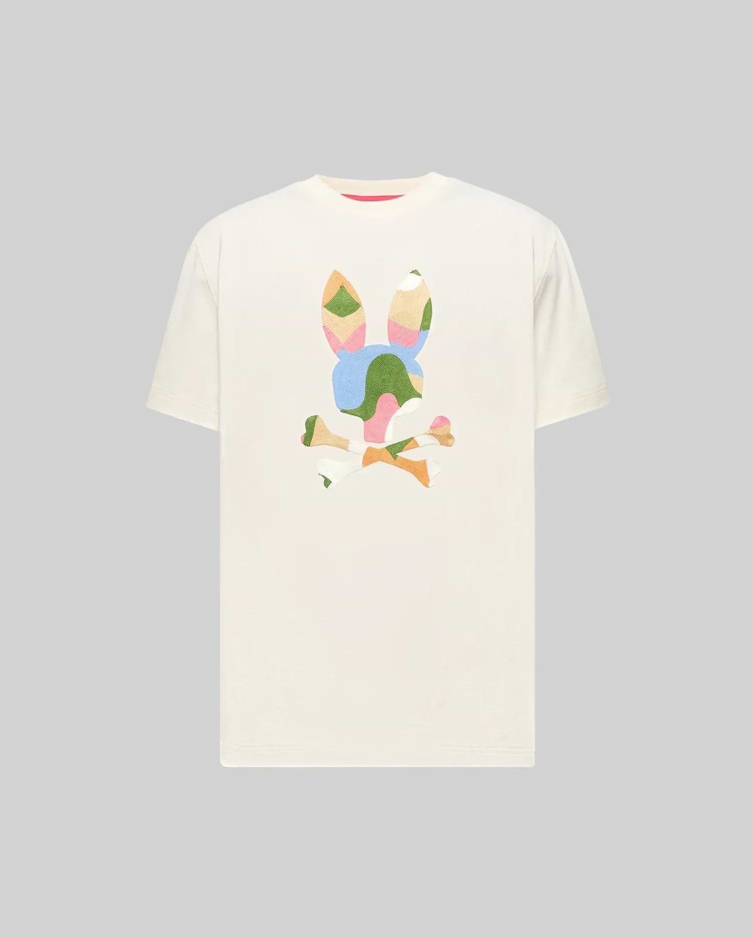 Cream Mens Ara Graphic Tee, a classic fit jersey t-shirt featuring a large, vibrant, abstract Psycho Bunny skull graphic on the chest with multicolored, textured patchwork details. (1)