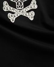 Mens Brad Graphic Tee, black smooth jersey with a large white embroidered Psycho Bunny skull and crossbones graphic, featuring tropical palm trees and mini bunny skulls within the bones. (6)