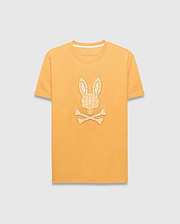 Mens Brad Graphic Tee, marigold yellow classic fit jersey t-shirt with a large cream repeating Psycho Bunny logo pattern graphic on the chest and a small logo on the back neck.