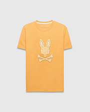 Mens Brad Graphic Tee, marigold yellow classic fit jersey t-shirt with a large cream repeating Psycho Bunny logo pattern graphic on the chest and a small logo on the back neck.