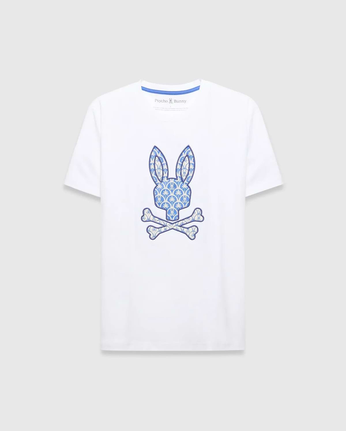White Mens Brad Graphic Tee, classic fit jersey with a large central blue and cream patterned bunny skull logo and blue Psycho Bunny neck tape. (1)