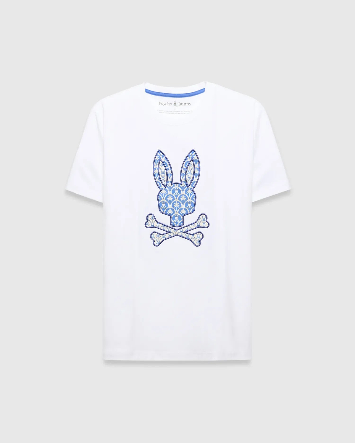 White Mens Brad Graphic Tee, classic fit jersey with a large central blue and cream patterned bunny skull logo and blue Psycho Bunny neck tape. (1)