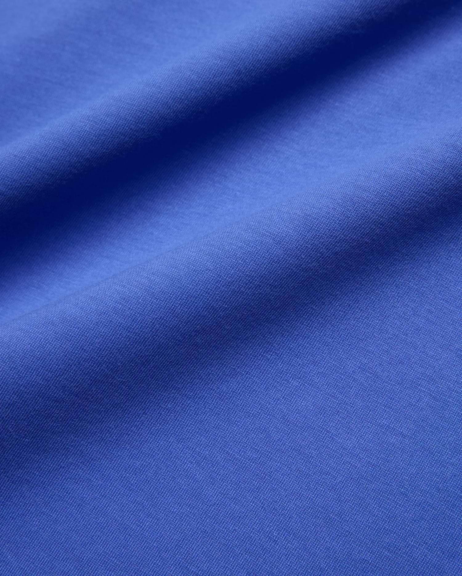 Mens Sunny Chest Graphic Tee in vibrant royal blue, featuring a smooth jersey knit fabric and an implied chest graphic with the iconic Psycho Bunny skull logo. (6)