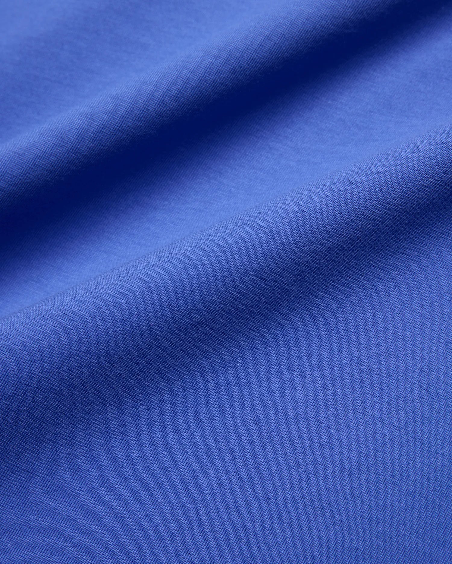 Mens Sunny Chest Graphic Tee in vibrant royal blue, featuring a smooth jersey knit fabric and an implied chest graphic with the iconic Psycho Bunny skull logo. (6)