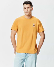 Mens Sunny Chest Graphic Tee. Classic fit mustard yellow smooth jersey t-shirt with a small embroidered Psycho Bunny skull logo wearing red sunglasses and white crossbones on the left chest. (2)