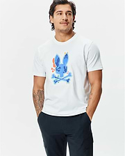 Mens Tanner Bunny Graphic Tee, a classic fit white jersey t-shirt featuring a large, vibrant blue, orange, and green camouflage-patterned Psycho Bunny skull logo graphic on the chest. (2)