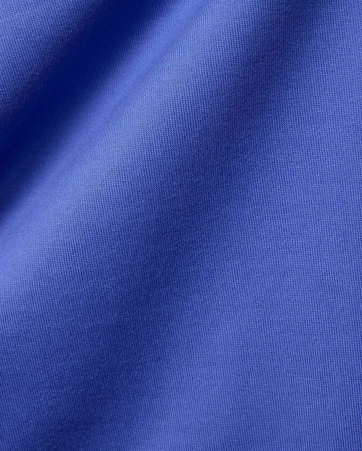 Mens Craig Wordmark Tee crafted from a premium, vibrant blue jersey knit fabric, showcasing a smooth texture with subtle vertical ribbing and elegant, soft folds. (6)