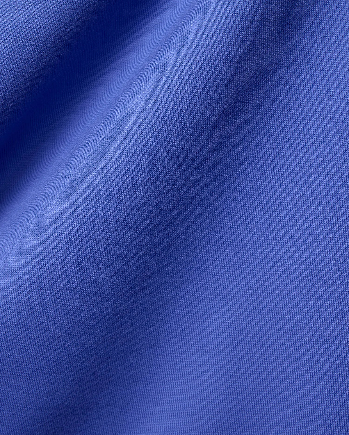 Mens Craig Wordmark Tee crafted from a premium, vibrant blue jersey knit fabric, showcasing a smooth texture with subtle vertical ribbing and elegant, soft folds. (6)