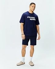 Mens Craig Wordmark Tee, a navy blue relaxed fit jersey tee with a large white PSYCHO BUNNY chest graphic, paired with matching navy knit shorts. (4)