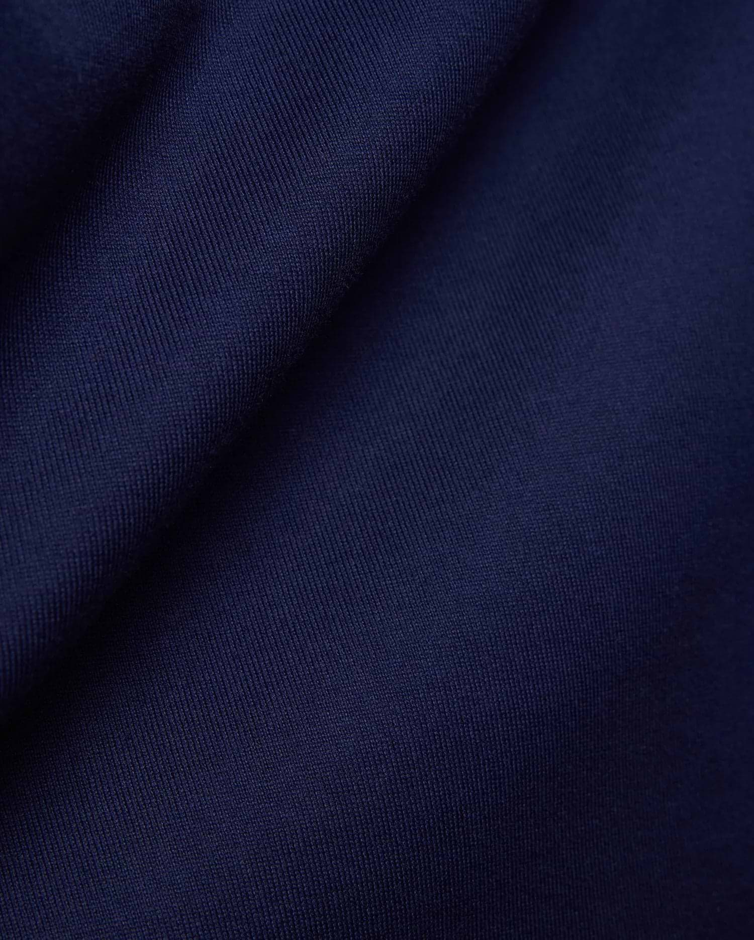 Psycho Bunny Mens Craig Wordmark Tee in rich, deep navy blue, crafted from a premium, soft, finely textured jersey knit fabric, embodying refined streetwear style. (6)