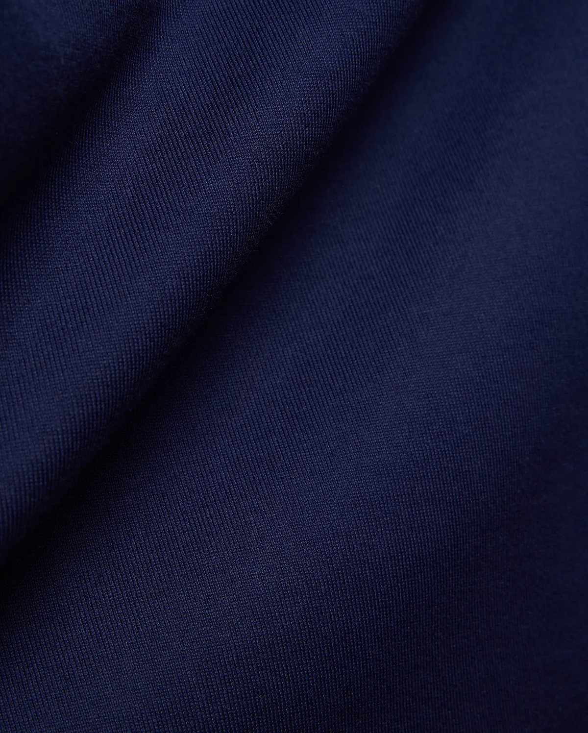 Psycho Bunny Mens Craig Wordmark Tee in rich, deep navy blue, crafted from a premium, soft, finely textured jersey knit fabric, embodying refined streetwear style. (6)