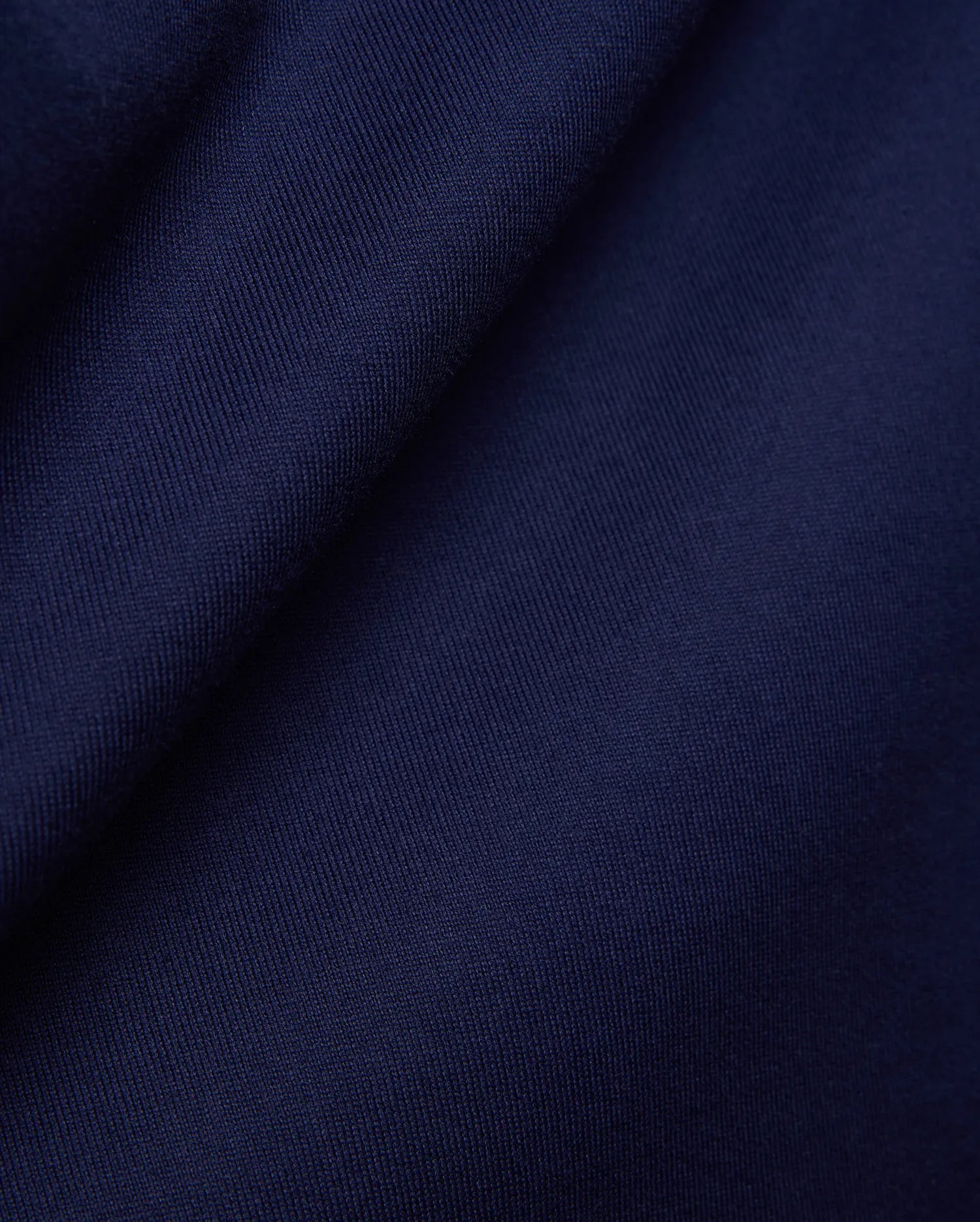 Psycho Bunny Mens Craig Wordmark Tee in rich, deep navy blue, crafted from a premium, soft, finely textured jersey knit fabric, embodying refined streetwear style. (6)