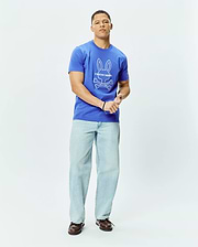 Mens Craig Graphic Tee, a royal blue classic fit jersey t-shirt featuring a large white Psycho Bunny skull and crossbones graphic logo centered on the chest. (4)