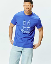 Mens Craig Graphic Tee, royal blue classic fit jersey knit t-shirt featuring a large, central white embroidered Psycho Bunny skull and crossbones logo with PSYCHO BUNNY text. (1)