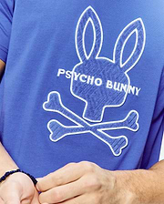 Mens Craig Graphic Tee in royal blue jersey knit, featuring a large white-outlined blue chenille Psycho Bunny skull graphic and embroidered Psycho Bunny text on the chest. (2)