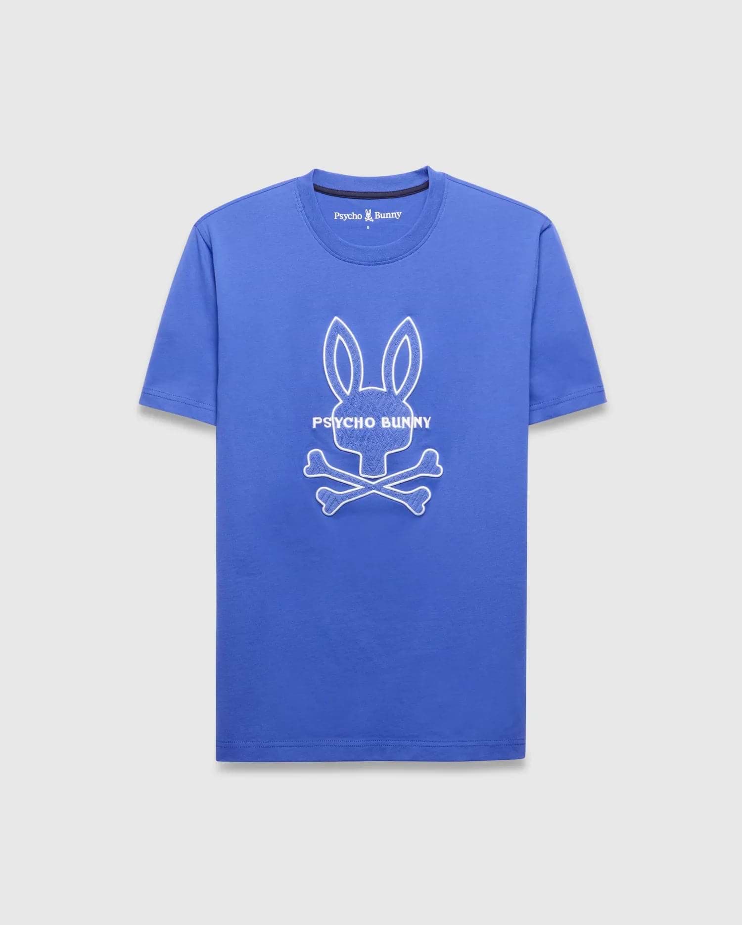 Mens Craig Graphic Tee, royal blue classic fit smooth jersey with a large white outline Psycho Bunny skull graphic and PSYCHO BUNNY text on the chest, plus a small embroidered logo on the back neck. (5)