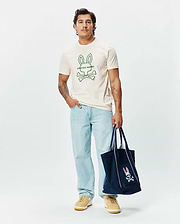 Mens Craig Graphic Tee, a classic fit cream soft jersey crew neck t-shirt featuring a large green outline Psycho Bunny skull and crossbones logo with text on the center chest. (2)