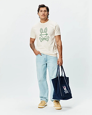 Mens Craig Graphic Tee, a classic fit cream soft jersey crew neck t-shirt featuring a large green outline Psycho Bunny skull and crossbones logo with text on the center chest. (2)
