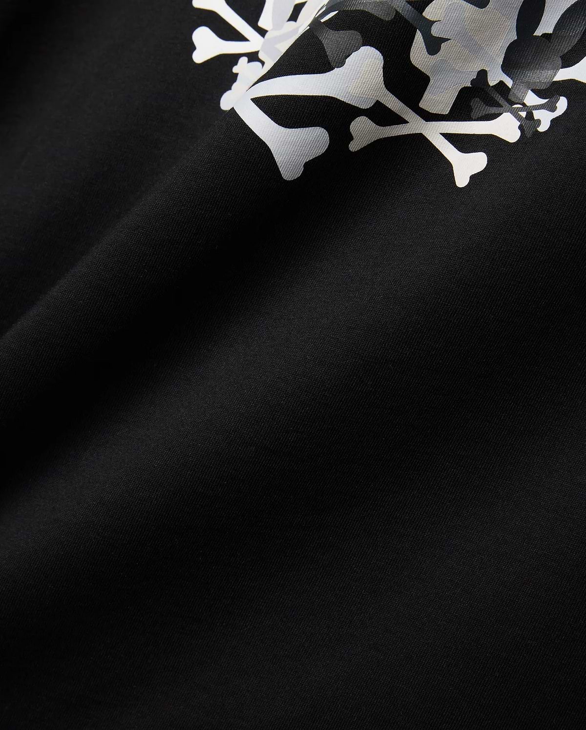 Mens Tanner Graphic Tee, black jersey knit fabric displaying a prominent, large white and subtle grey camouflage Psycho Bunny iconic bunny skull graphic print.