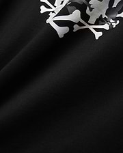 Mens Tanner Graphic Tee, black jersey knit fabric displaying a prominent, large white and subtle grey camouflage Psycho Bunny iconic bunny skull graphic print.