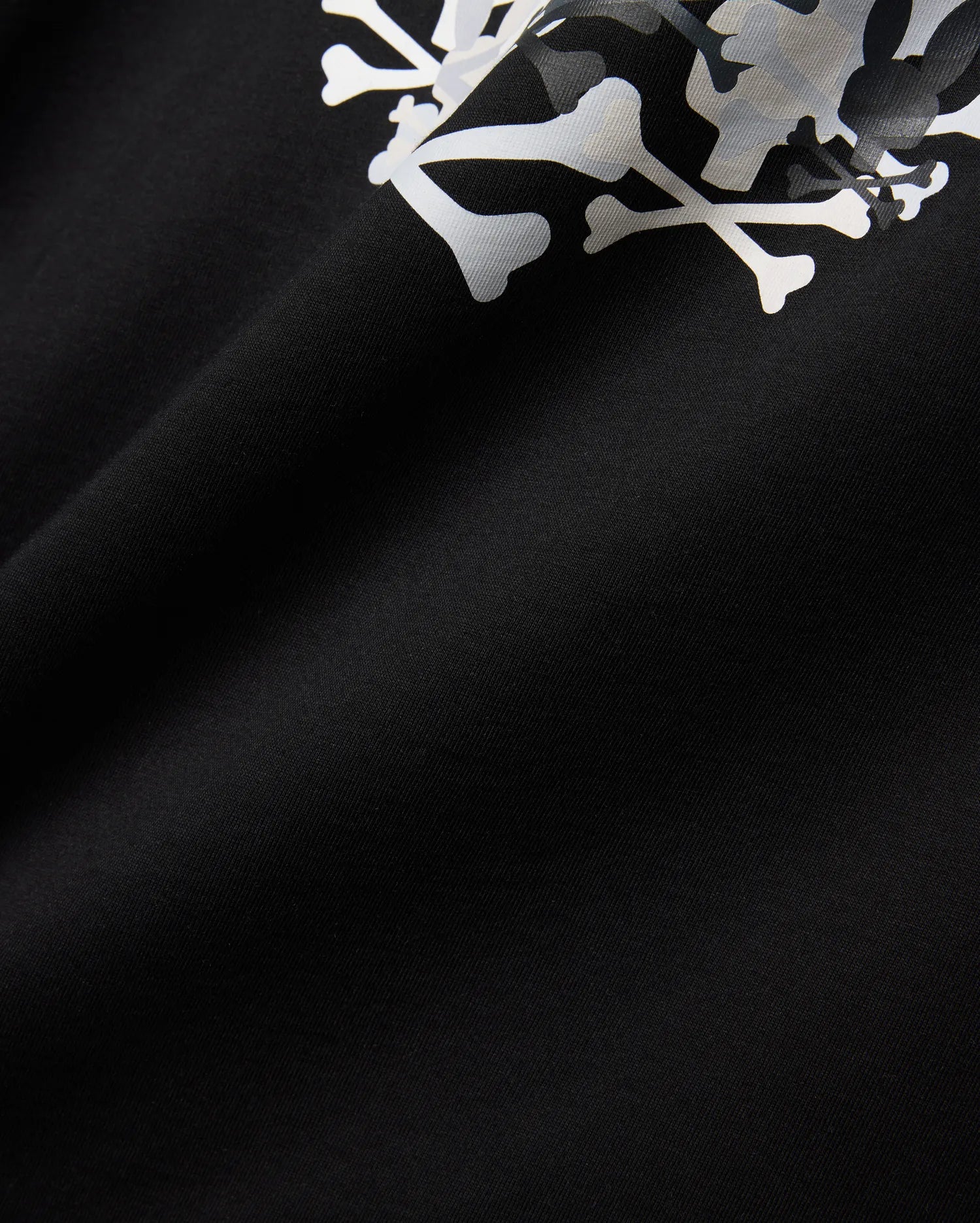 Mens Tanner Graphic Tee, black jersey knit fabric displaying a prominent, large white and subtle grey camouflage Psycho Bunny iconic bunny skull graphic print.