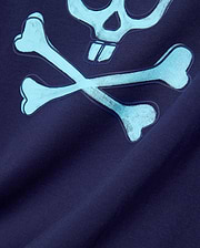 Mens Adler Graphic Tee in navy jersey knit, featuring a large light blue Psycho Bunny skull and crossbones graphic with a textured outline and halftone fill. (5)