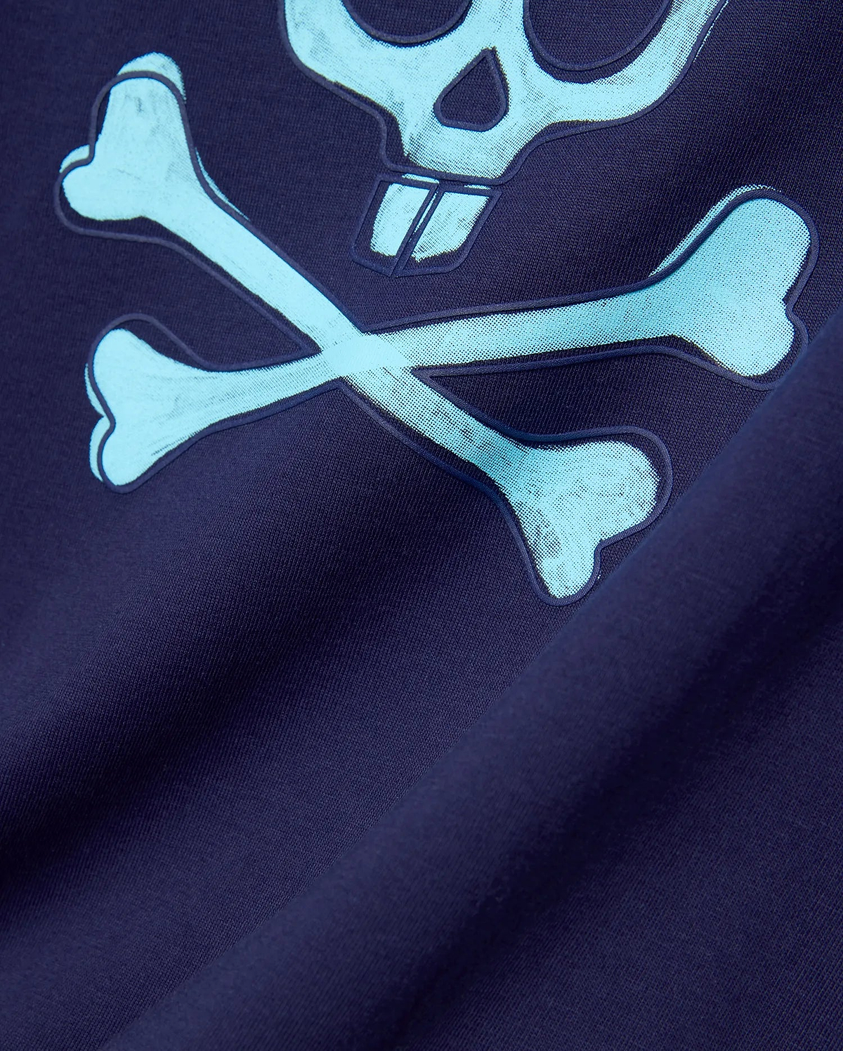 Mens Adler Graphic Tee in navy jersey knit, featuring a large light blue Psycho Bunny skull and crossbones graphic with a textured outline and halftone fill. (5)
