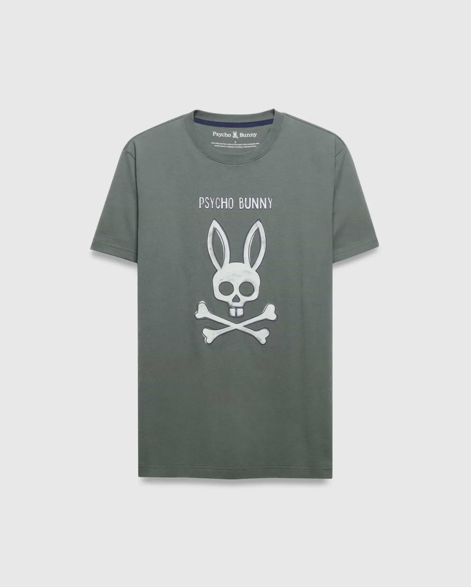 Mens Adler Graphic Tee, dark sage green classic fit jersey t-shirt with a large distressed white Psycho Bunny text and skull-and-crossbones graphic on the chest, plus navy inner collar trim.