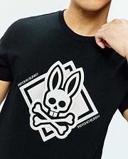 Mens Tobias Graphic Tee, black classic fit jersey t-shirt with a large white embroidered Psycho Bunny skull and crossbones chest logo, with square outline and PSYCHO BUNNY text, red inner collar.