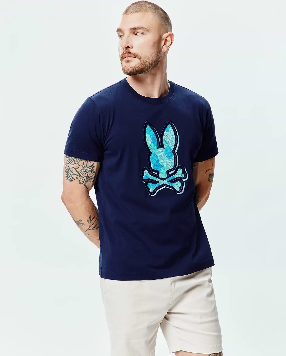 Mens Ethan Graphic Tee, navy classic fit jersey t-shirt with a large center chest Psycho Bunny skull logo featuring a blue and light blue camouflage pattern fill. (3)