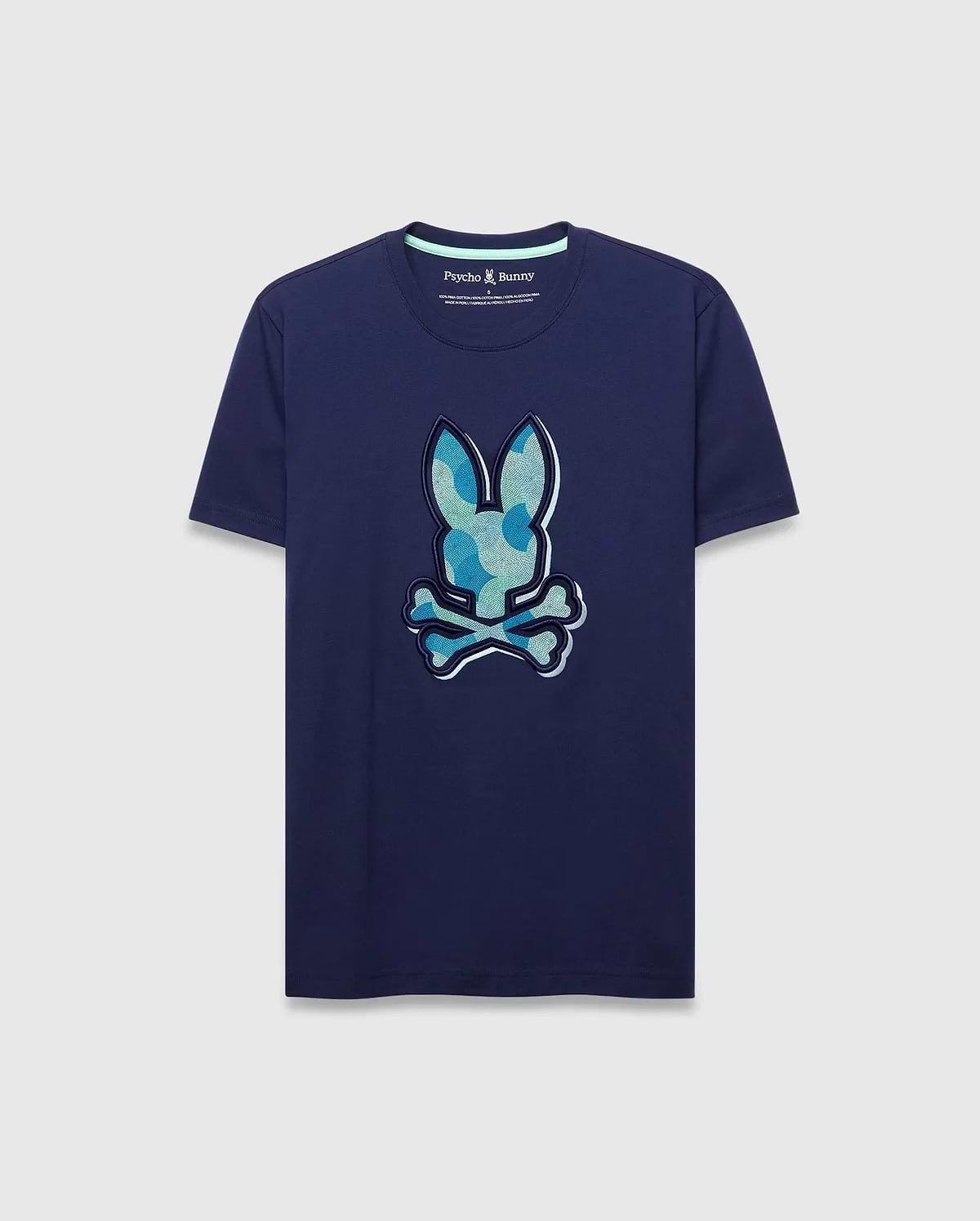 Mens Ethan Graphic Tee. Navy classic fit jersey t-shirt with a large center chest Psycho Bunny skull logo featuring a blue and green camouflage pattern, outlined in white. (1)