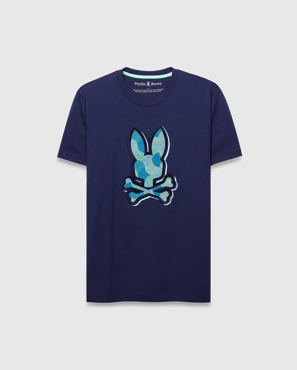 Mens Ethan Graphic Tee. Navy classic fit jersey t-shirt with a large center chest Psycho Bunny skull logo featuring a blue and green camouflage pattern, outlined in white. (1)