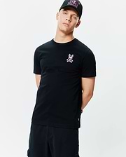 Mens Frank Back Graphic Tee, a black classic fit jersey t-shirt with a small embroidered pink Psycho Bunny skull logo on the left chest and a back graphic.