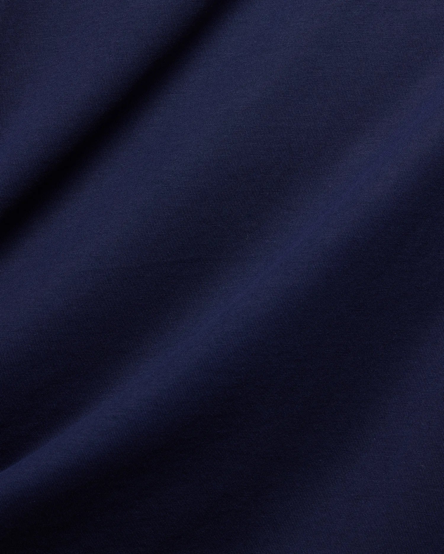 Rich, deep navy blue jersey knit fabric, showcasing a refined, smooth texture with subtle diagonal ribbing and soft, flowing folds, for the Mens Frank Back Graphic Tee.