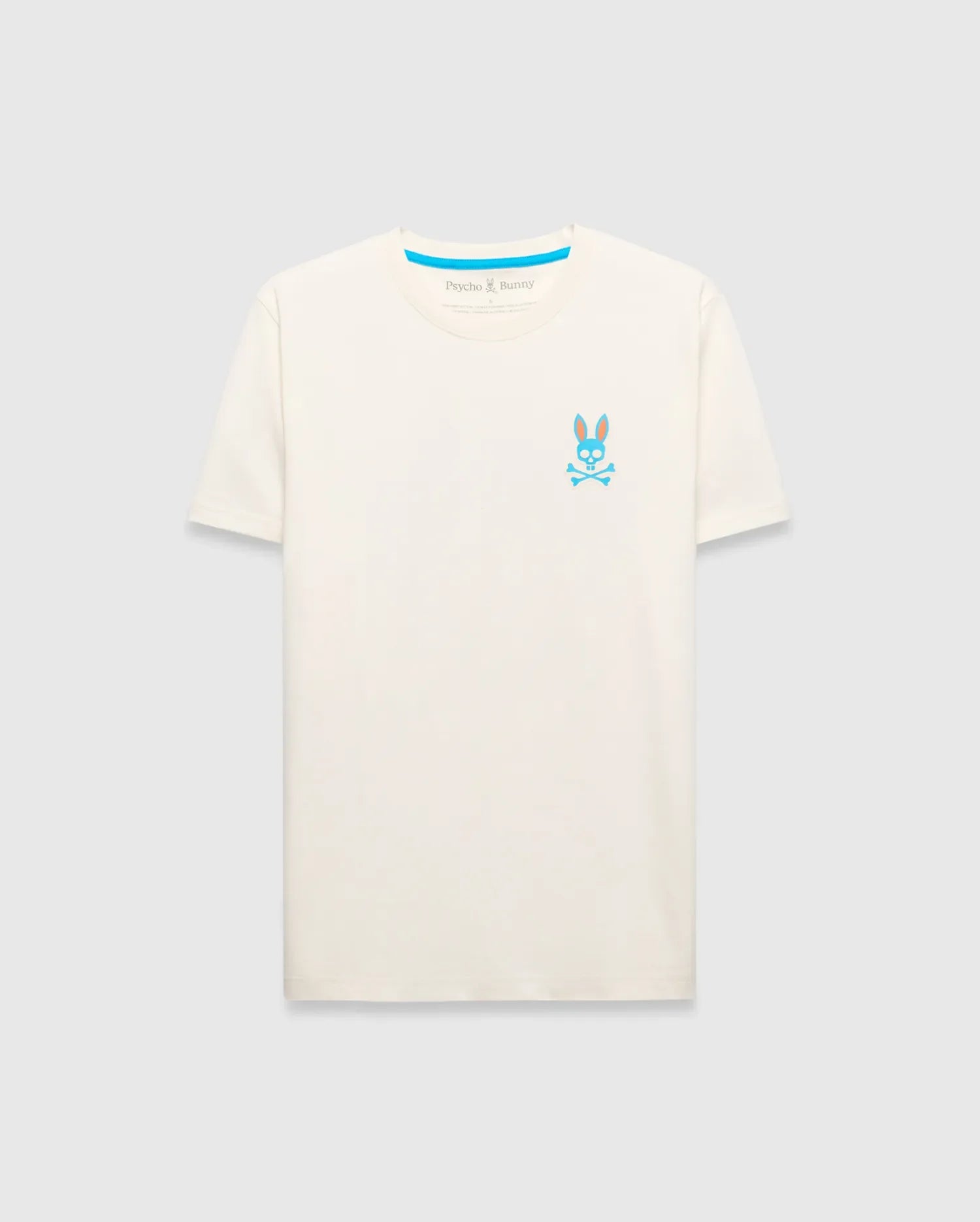 Mens Frank Back Graphic Tee, a classic fit cream jersey t-shirt featuring a small vibrant blue and orange Psycho Bunny skull logo on the left chest and signature blue neck tape.