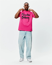 Mens Duncan Wordmark Relaxed Fit Tee in hot pink smooth jersey, featuring a large black Psycho Bunny wordmark graphic with a dripping paint effect on the chest.
