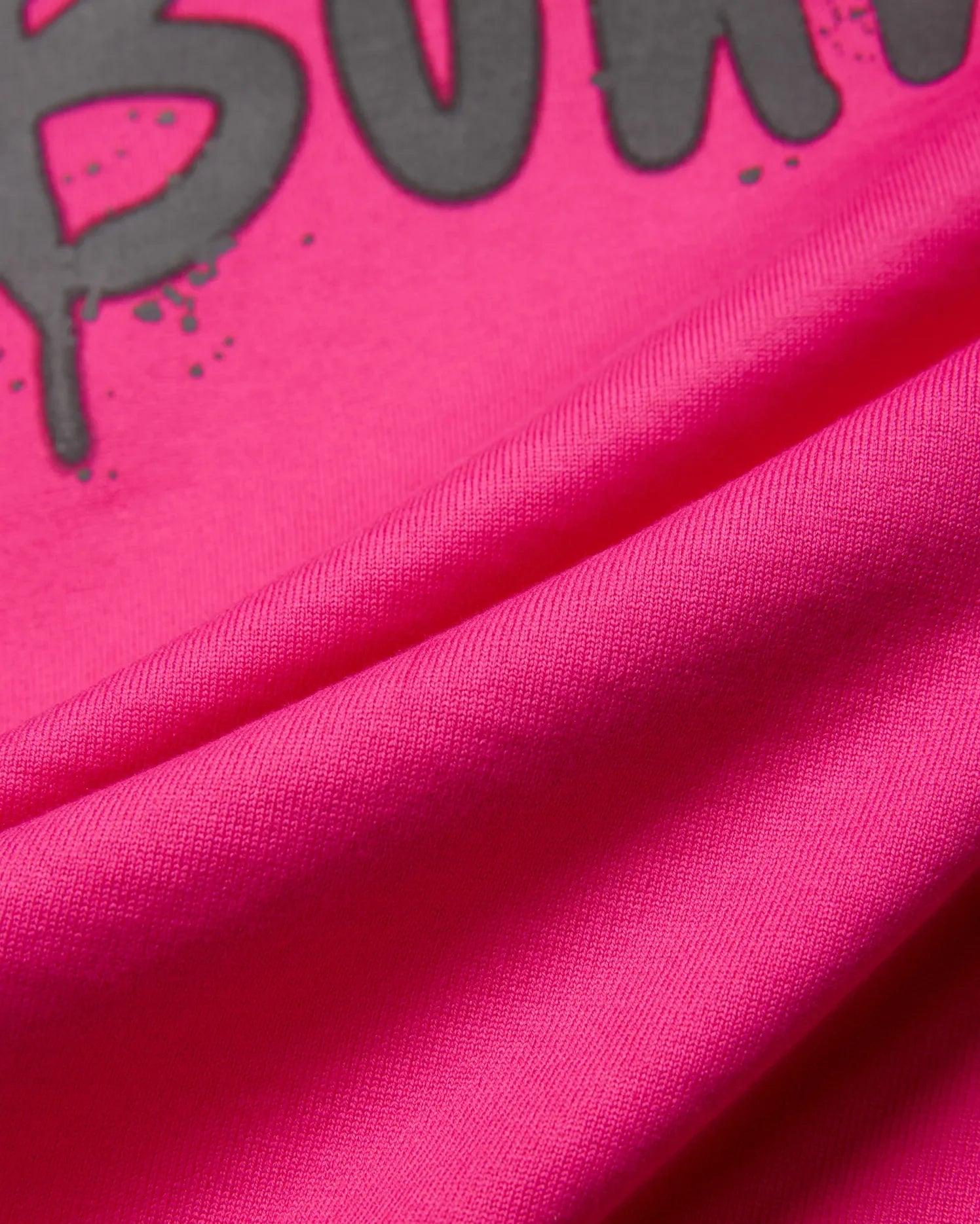 Mens Duncan Wordmark Relaxed Fit Tee in bright fuchsia jersey knit, featuring a large dark grey wordmark graphic with splatter details, designed for a relaxed fit.