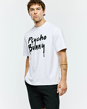 Mens Duncan Wordmark Relaxed Fit Tee, a crisp white cotton jersey t-shirt with a bold, large black spray paint drip effect Psycho Bunny wordmark graphic centered on the chest.
